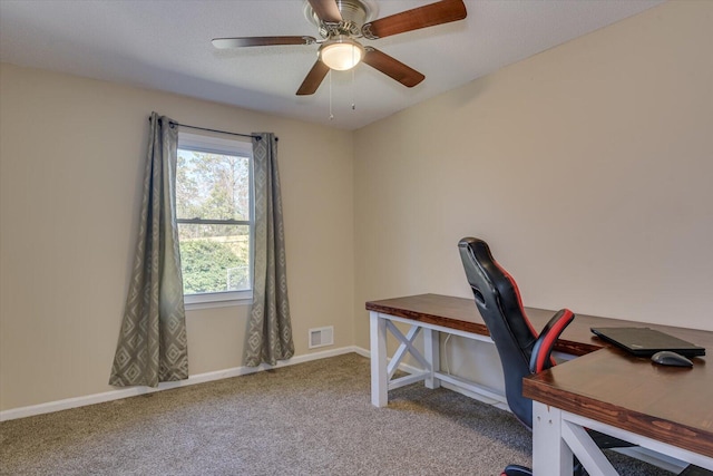 home office featuring visible vents, ceiling fan, baseboards, and carpet