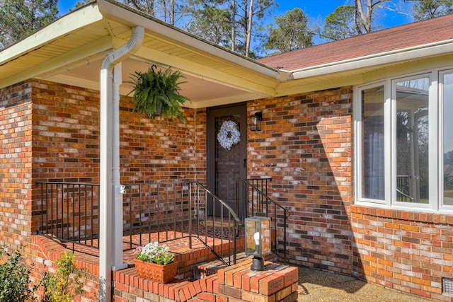 entrance to property with brick siding