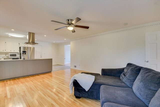 living area with visible vents, recessed lighting, a ceiling fan, and light wood-style floors