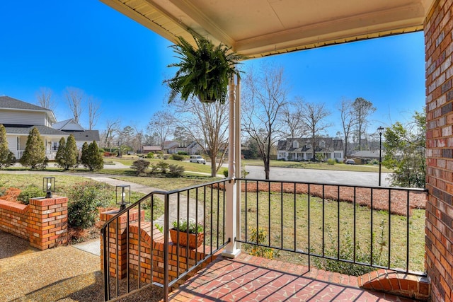 view of patio featuring a residential view and covered porch