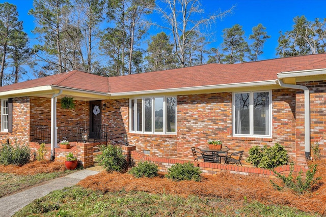 view of front of home featuring brick siding