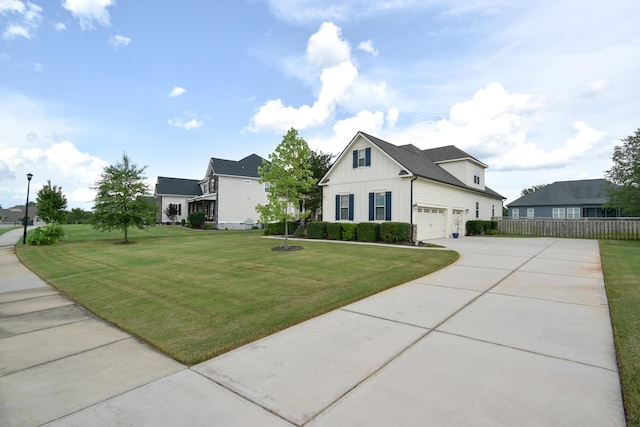 view of front of property featuring a garage and a front lawn