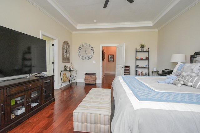 bedroom with dark hardwood / wood-style flooring, ceiling fan, and ornamental molding