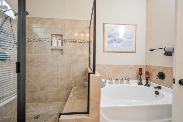 bathroom with separate shower and tub