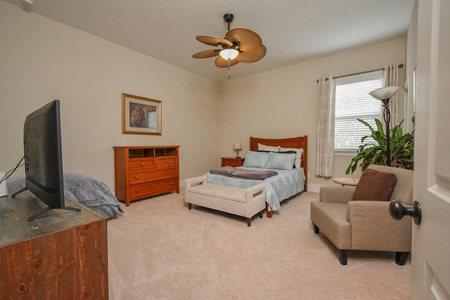 bedroom with ceiling fan and light colored carpet