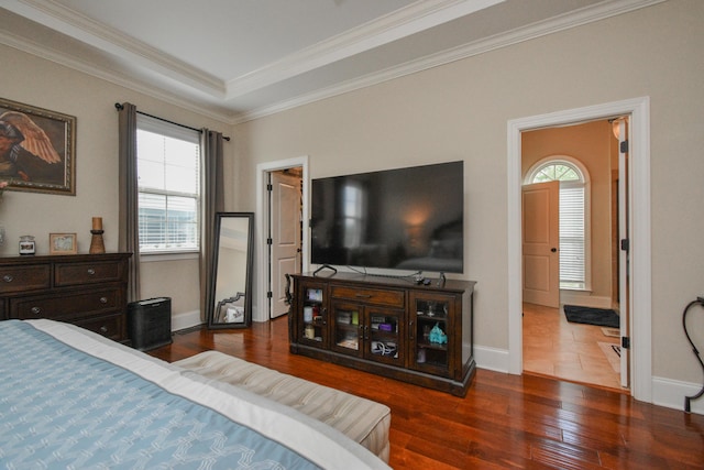 bedroom featuring crown molding and dark hardwood / wood-style floors