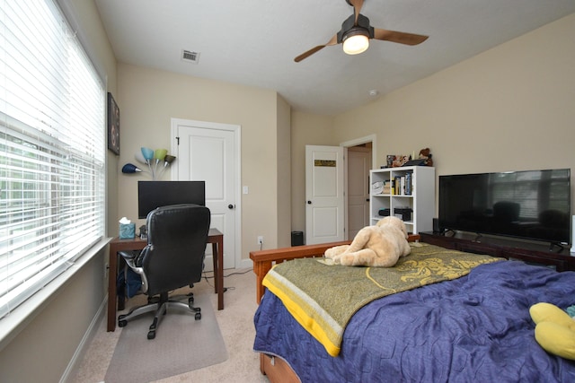 carpeted bedroom featuring ceiling fan