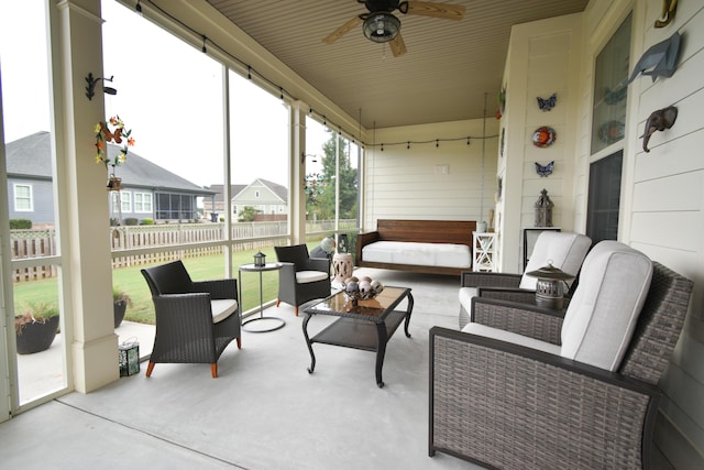 sunroom with ceiling fan