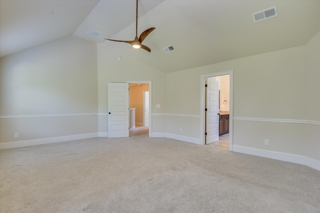 1037 Dietrich Ln, North Augusta, SC 29860 - unfurnished bedroom featuring vaulted ceiling, light carpet, baseboards, a ceiling fan, and connected bathroom