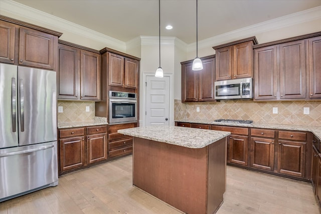 1037 Dietrich Ln, North Augusta, SC 29860 - kitchen featuring appliances with stainless steel finishes, light stone counters, recessed lighting, a kitchen island, and light wood-style flooring