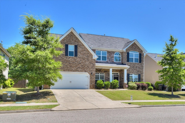 1037 Dietrich Ln, North Augusta, SC 29860 - view of front facade with concrete driveway, a front lawn, an attached garage, and brick siding