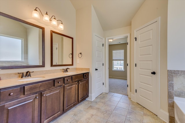 1037 Dietrich Ln, North Augusta, SC 29860 - full bath with double vanity, baseboards, and a bathtub