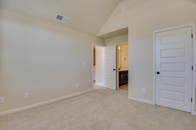 1037 Dietrich Ln, North Augusta, SC 29860 - unfurnished bedroom with light colored carpet, baseboards, ensuite bath, and high vaulted ceiling