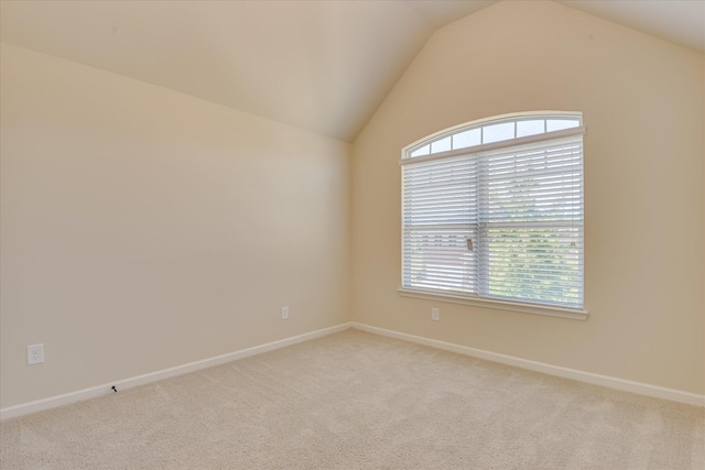 1037 Dietrich Ln, North Augusta, SC 29860 - empty room featuring light colored carpet, vaulted ceiling, and baseboards