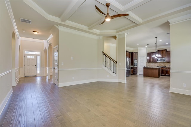 1037 Dietrich Ln, North Augusta, SC 29860 - unfurnished living room featuring hardwood / wood-style floors, ceiling fan, stairs, crown molding, and beam ceiling
