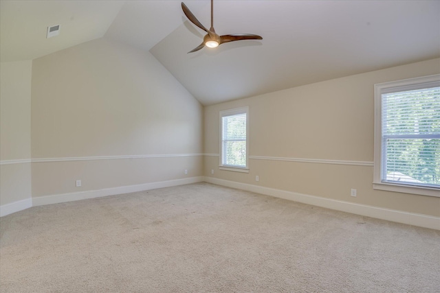 1037 Dietrich Ln, North Augusta, SC 29860 - empty room featuring lofted ceiling, healthy amount of natural light, ceiling fan, and light colored carpet