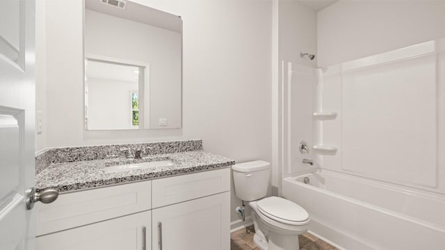 full bath featuring visible vents, vanity, toilet, and shower / bathing tub combination