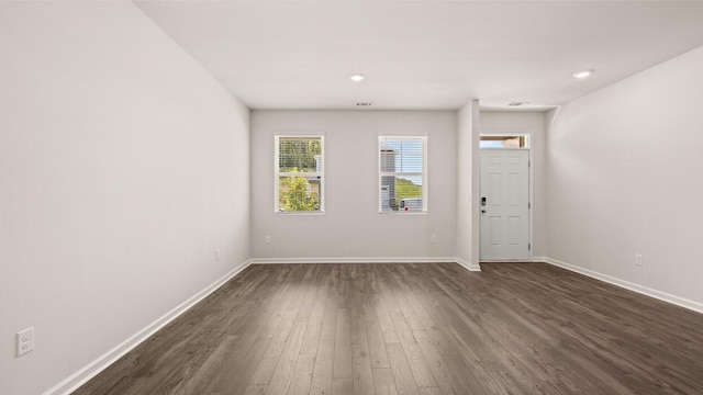 interior space featuring dark wood finished floors and baseboards