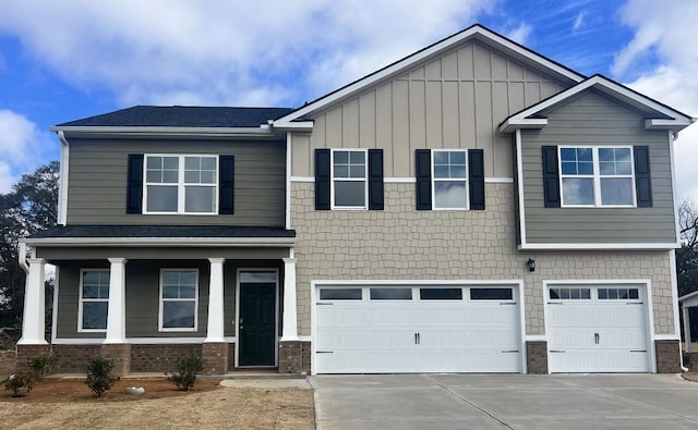 craftsman-style home with driveway, brick siding, roof with shingles, and an attached garage