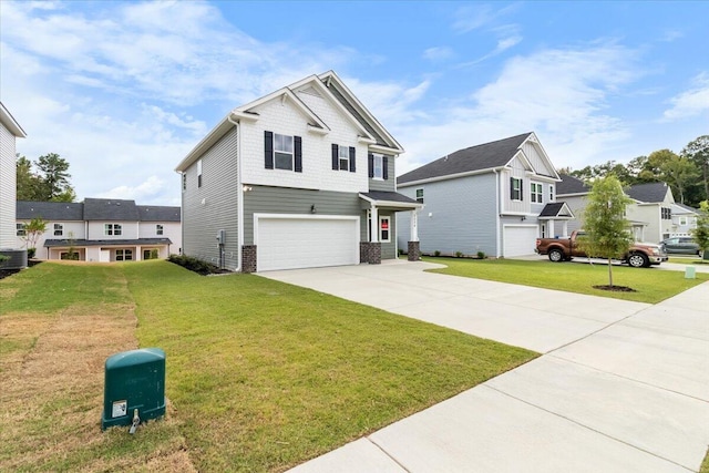 view of front of property featuring a front lawn and a garage