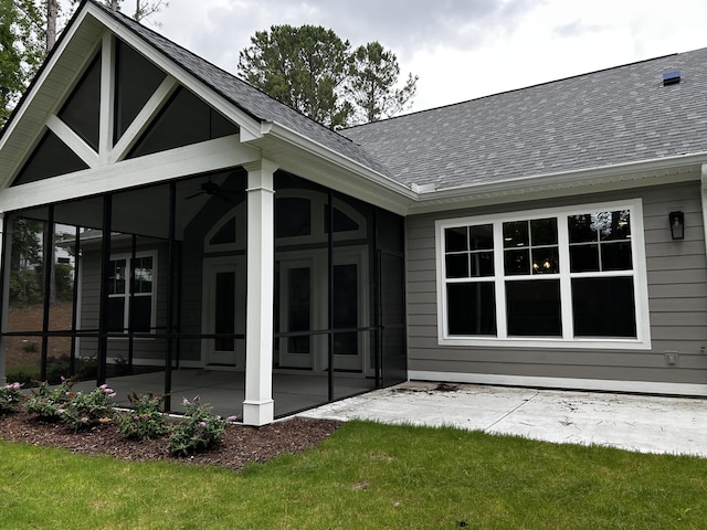 217 Holly Ln, Mccormick, SC 29835 - rear view of property with a patio, a sunroom, and roof with shingles
