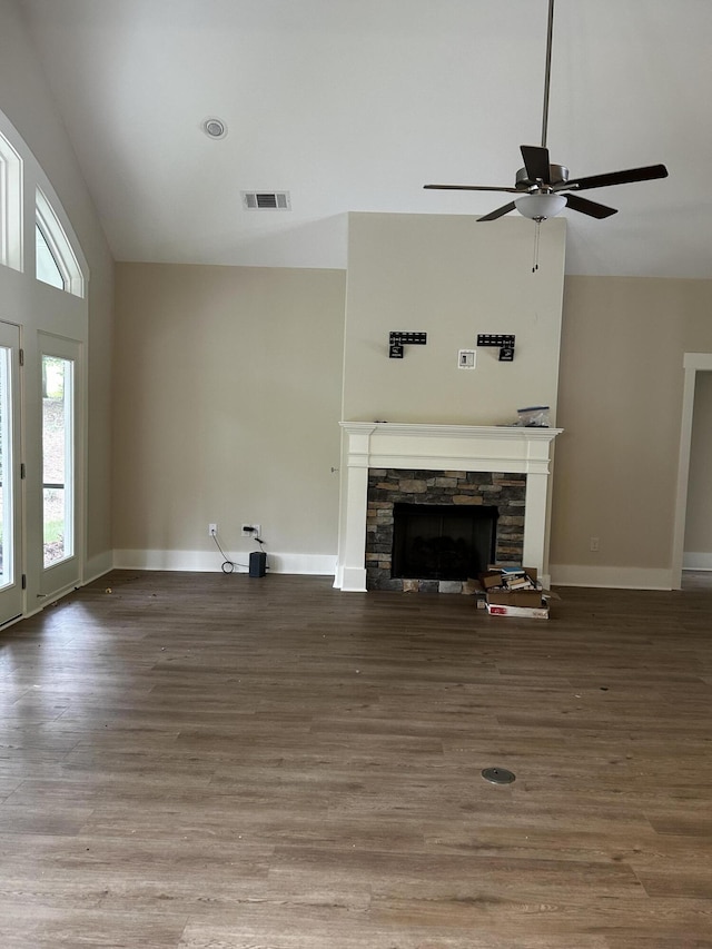 217 Holly Ln, Mccormick, SC 29835 - unfurnished living room featuring a fireplace, ceiling fan, wood finished floors, baseboards, and high vaulted ceiling