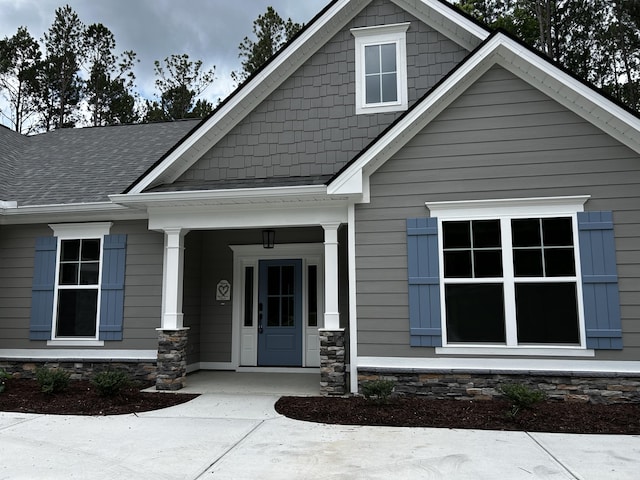 217 Holly Ln, Mccormick, SC 29835 - doorway to property with covered porch and a shingled roof