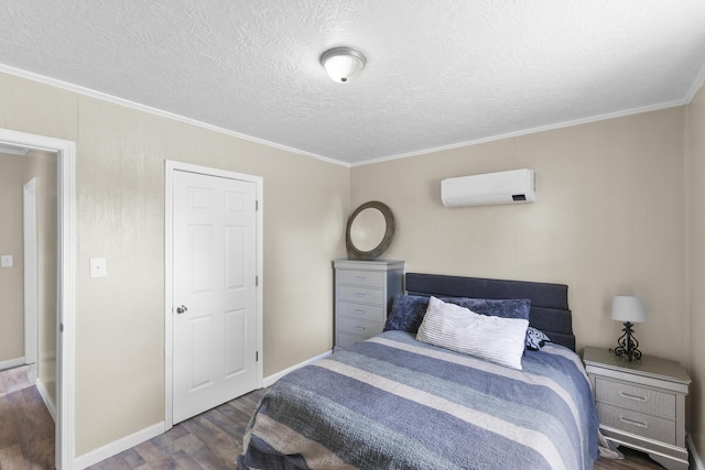 2028 Battle Row, Augusta, GA 30904 - bedroom featuring an AC wall unit, wood finished floors, crown molding, a textured ceiling, and baseboards