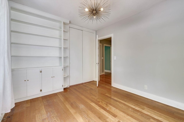 unfurnished bedroom featuring light wood-type flooring