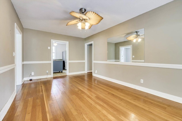 spare room featuring ceiling fan, wood-type flooring, and a textured ceiling