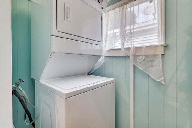 laundry area featuring stacked washer and dryer