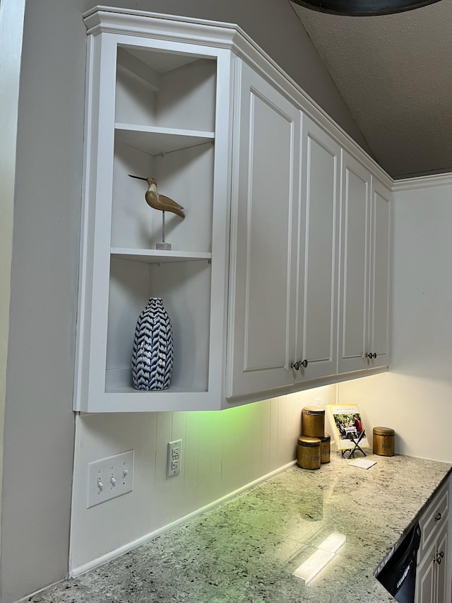 room details with white cabinets, dishwasher, and open shelves