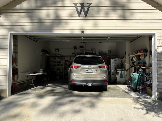 garage with concrete driveway