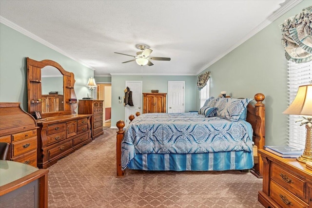 carpeted bedroom featuring ceiling fan, ornamental molding, a textured ceiling, and a closet