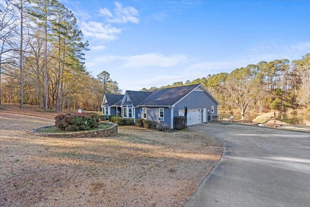 ranch-style home featuring a garage