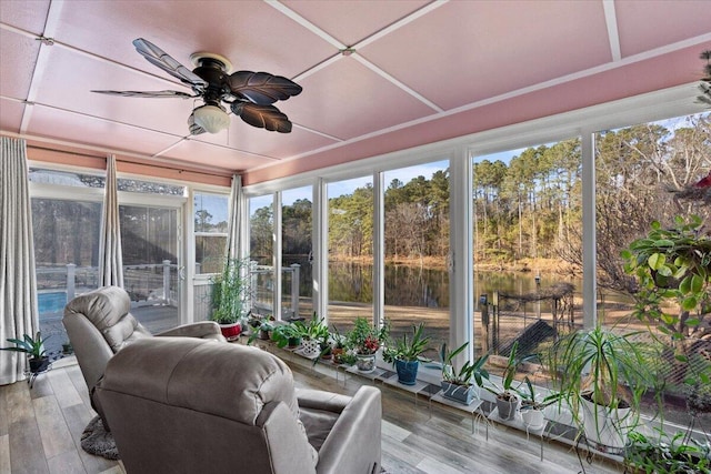 sunroom / solarium featuring ceiling fan