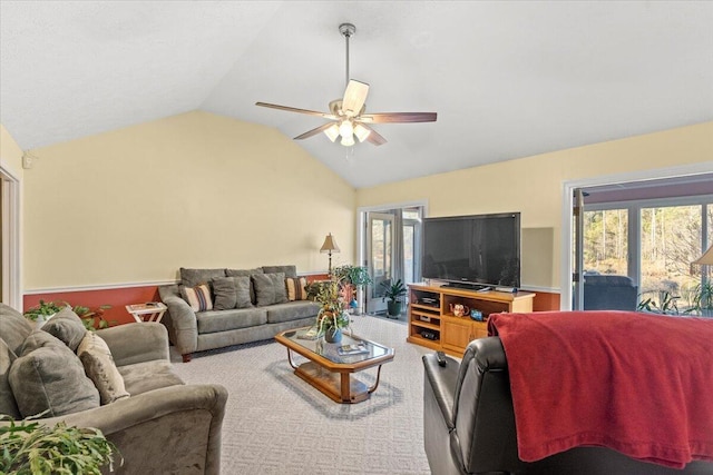 living room featuring ceiling fan and vaulted ceiling