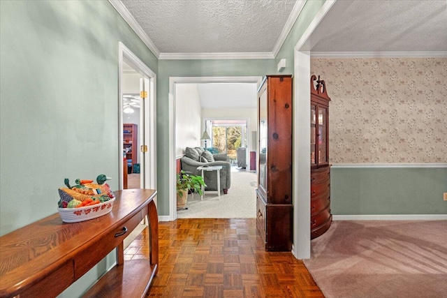 corridor with dark parquet flooring, a textured ceiling, and crown molding