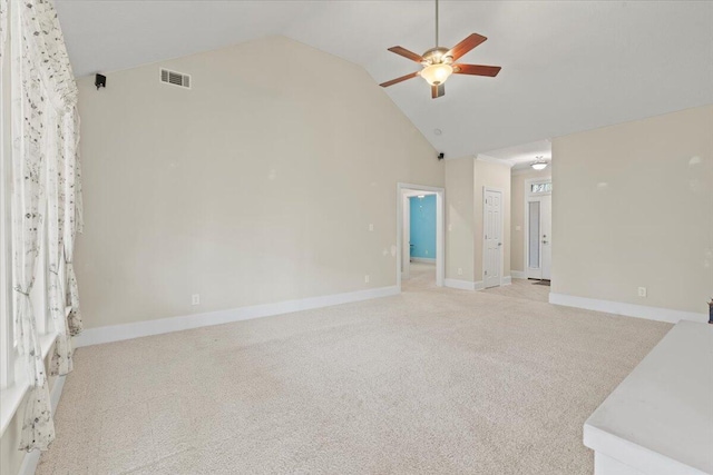 interior space with ceiling fan, light colored carpet, and high vaulted ceiling