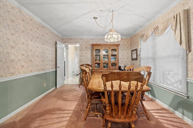 carpeted dining area featuring a chandelier, a textured ceiling, and crown molding