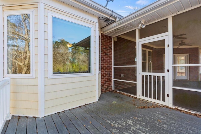 deck with a sunroom