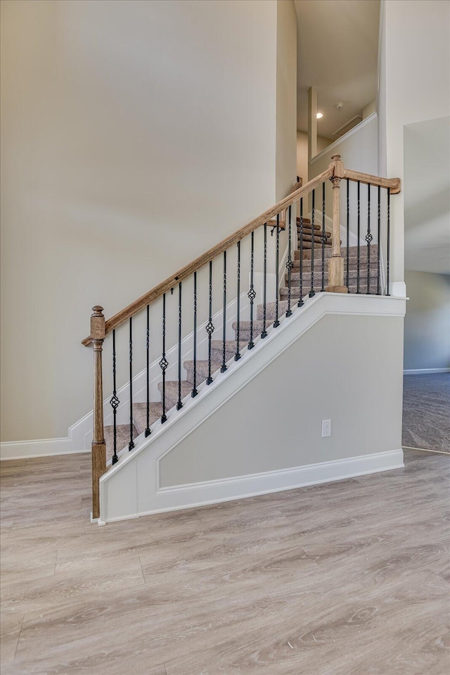 stairway with wood-type flooring