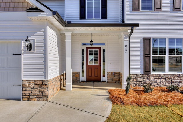 doorway to property with a garage