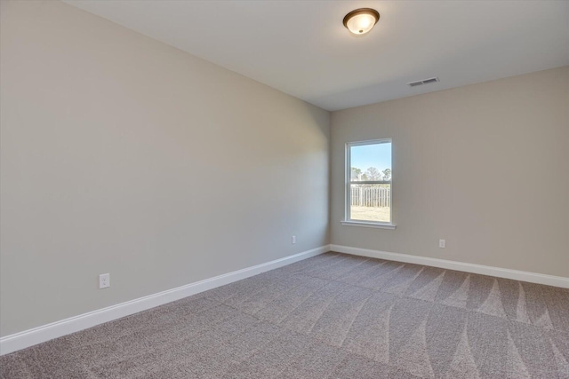 unfurnished room featuring carpet floors