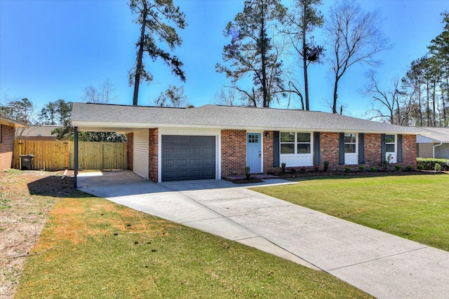 ranch-style house with a garage, brick siding, fence, driveway, and a front lawn