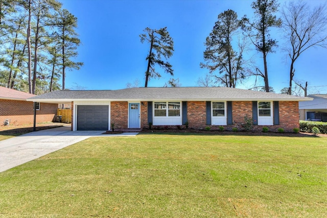 single story home featuring an attached garage, brick siding, driveway, and a front lawn