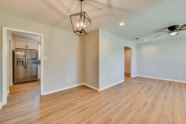 empty room featuring light wood-style flooring and baseboards