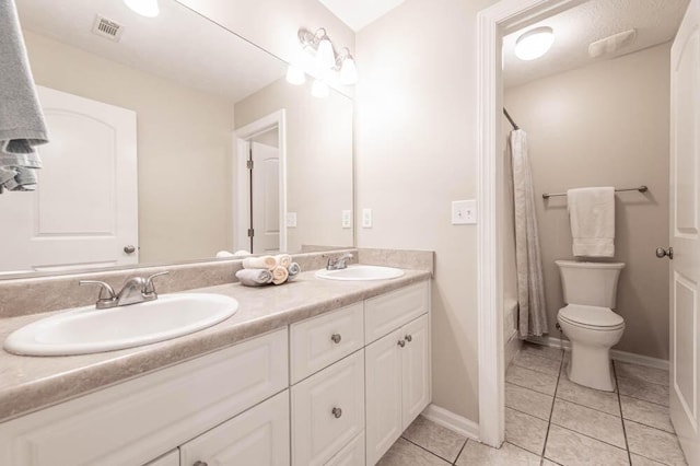 full bathroom with tile patterned floors, vanity, shower / bath combination with curtain, and toilet