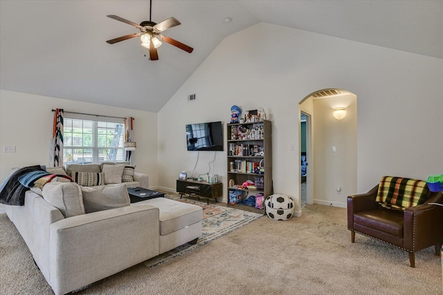 carpeted living room featuring high vaulted ceiling and ceiling fan