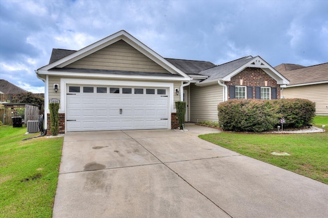 view of front of home with a garage and a front yard